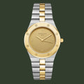 Two-tone watch with gold and silver band on a light gray background