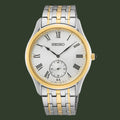 Two-tone Seiko watch with silver and gold band on a white background