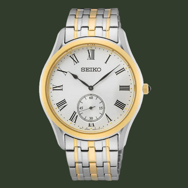 Two-tone Seiko watch with silver and gold band on a white background
