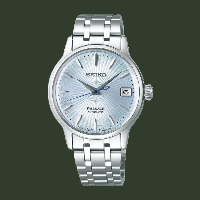 Silver Seiko watch with a blue face on a black background