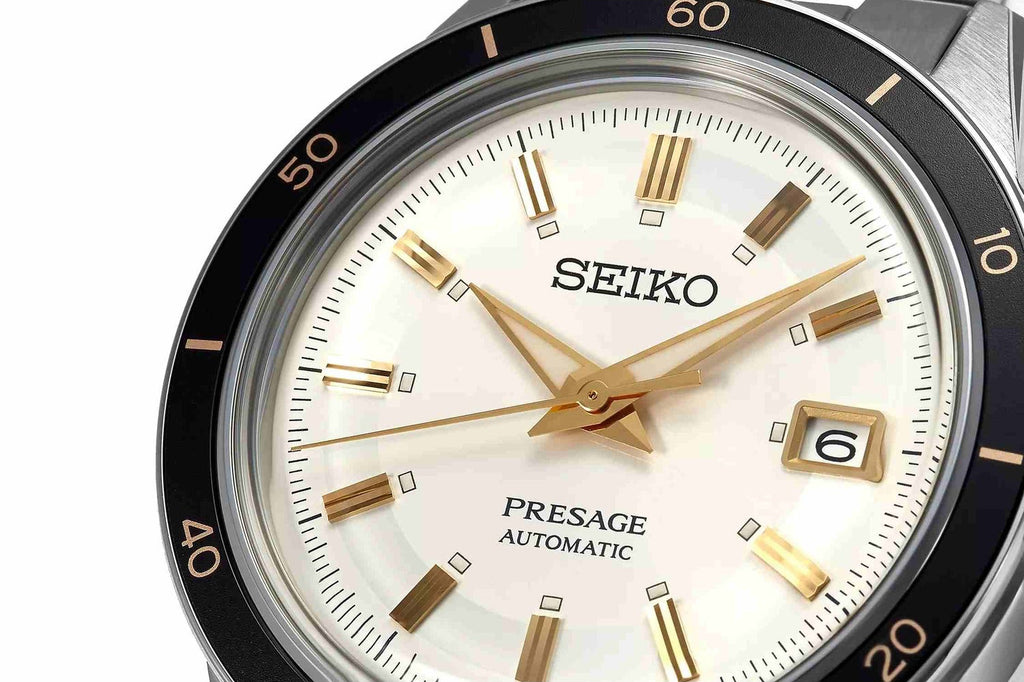 Seiko Presage watch with a white face and gold accents on a white background