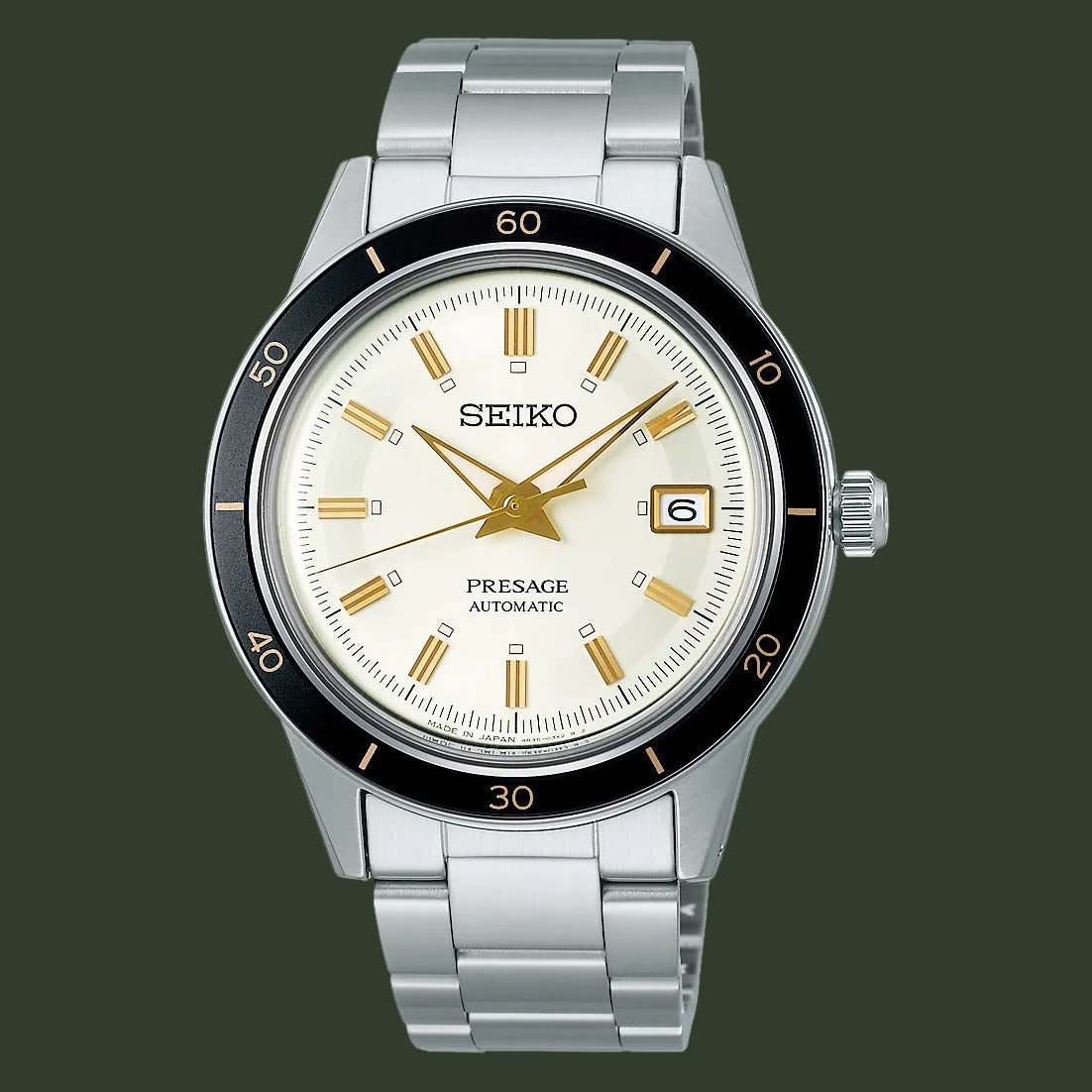 A Seiko Presage Automatic watch with a silver stainless steel link bracelet, a cream-colored dial with gold-tone hands and markers, and a black rotating bezel.