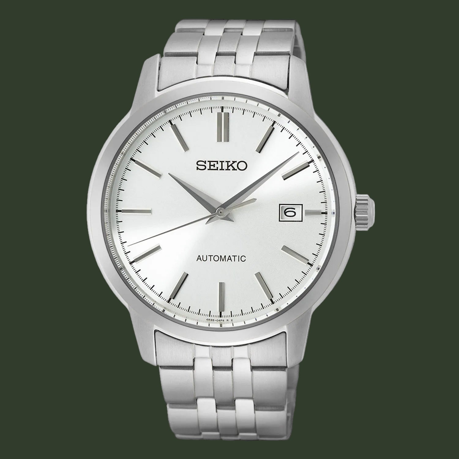 A Seiko automatic wristwatch with a silver stainless steel case and link bracelet, featuring a white dial with silver-tone hour markers and hands, and a date window at the 3 o'clock position.