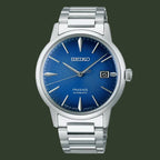 Seiko watch with blue dial and silver metal strap on a white background