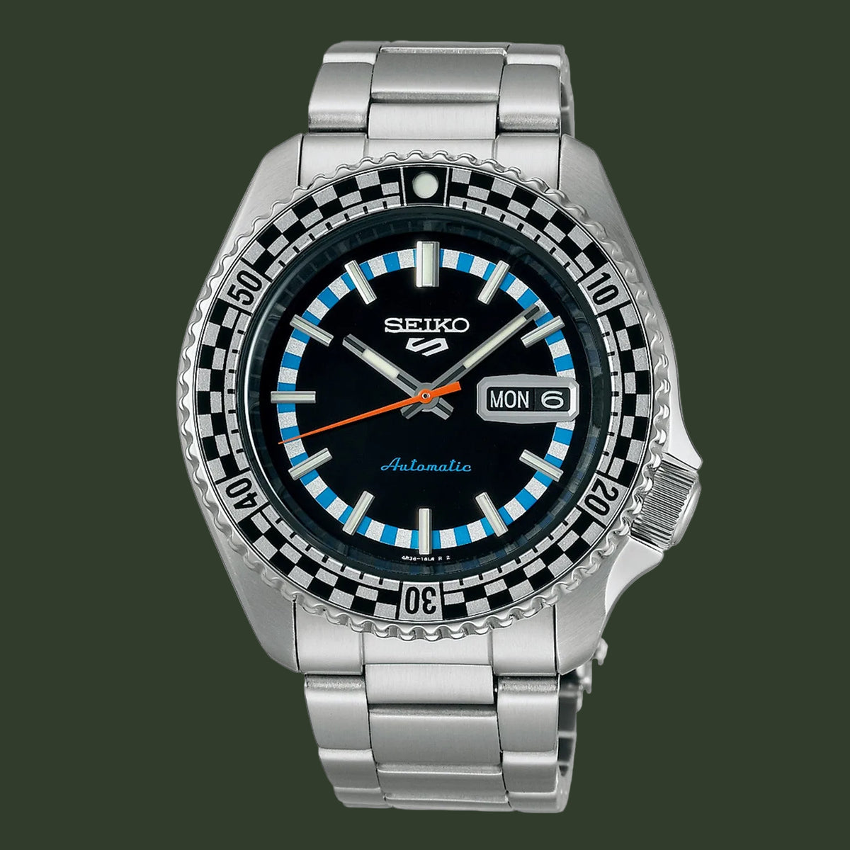 A Seiko automatic watch with a stainless steel link bracelet, featuring a black dial, a black and white checkered bezel, and light blue hour markers.