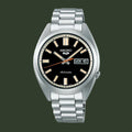 Seiko watch with black dial and silver metal bracelet on a white background