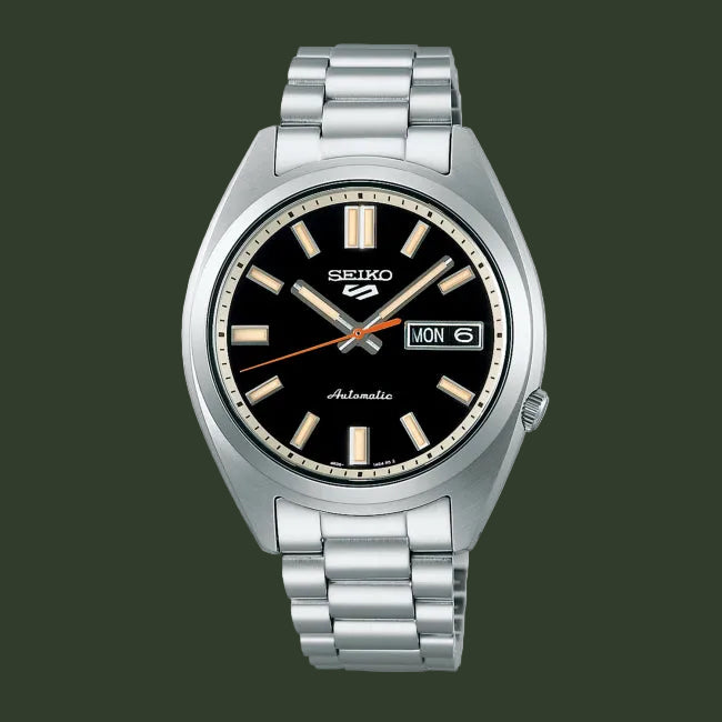 Seiko watch with black dial and silver metal bracelet on a white background