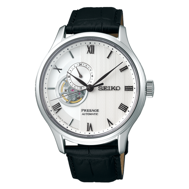A Seiko Presage Automatic watch with a silver-tone stainless steel case, a white textured dial featuring a skeletonized window showing the inner movement, and a black leather strap.