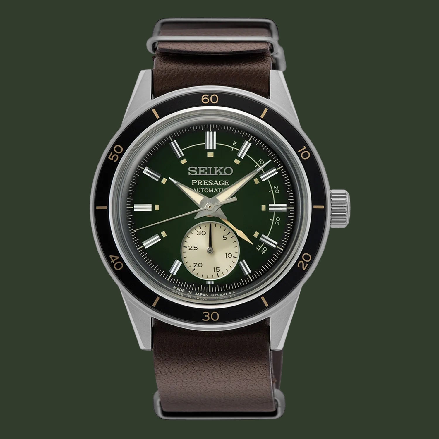 A Seiko Presage automatic watch with a dark green dial, black bezel, silver-toned case, and a brown leather strap, shown against a plain white background.