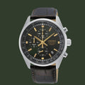 A Seiko chronograph watch with a dark green dial, silver-tone stainless steel case, and a dark brown leather strap, shown against a plain white background.