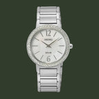 Silver Seiko watch with crystal bezel on a white background
