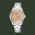 A Seiko women's analog watch with a silver stainless steel link bracelet, a round silver case, and a warm champagne-gold dial with silver hour markers and hands.