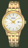 A Seiko analog watch with a gold-tone metal link bracelet, a gold bezel, and a white dial with gold hands and hour markers.