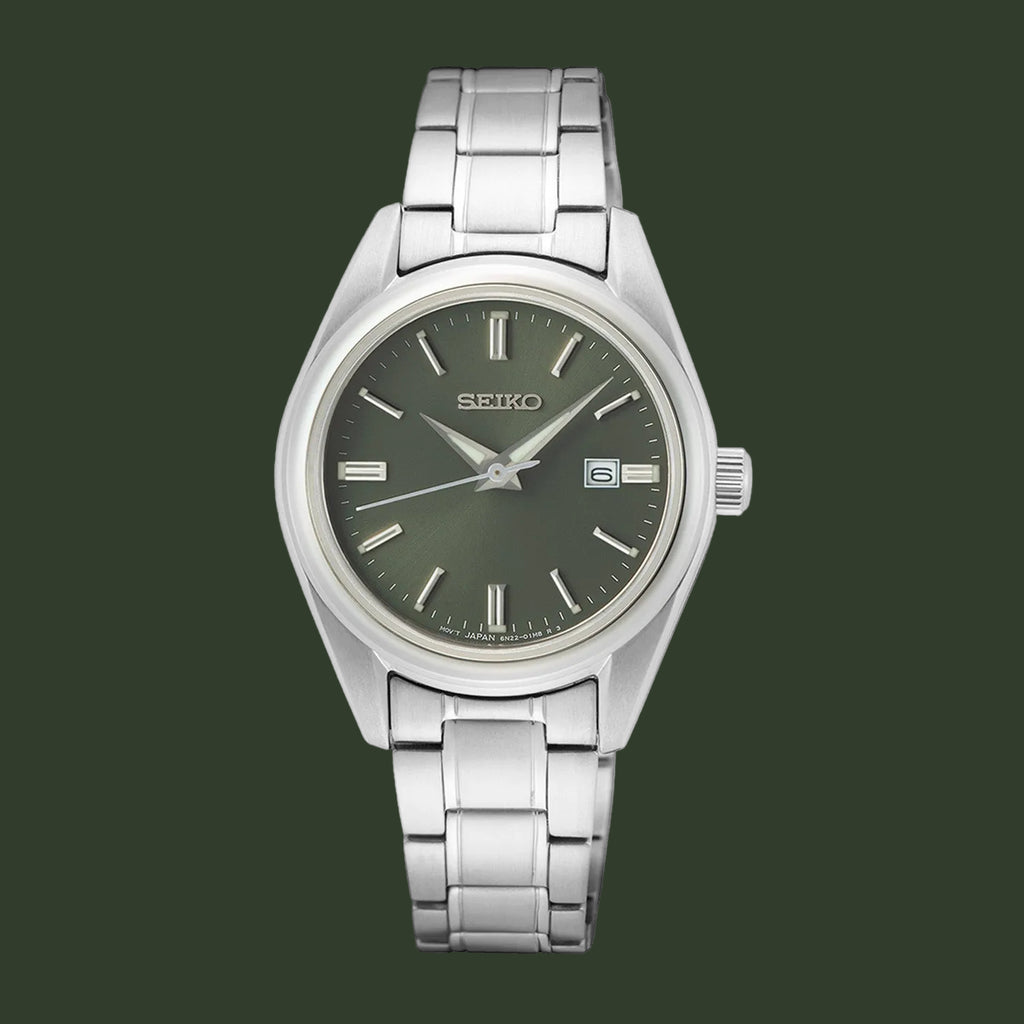 A Seiko stainless steel wristwatch with a dark olive green dial, silver-tone case, and matching metal link bracelet, shown against a plain white background.
