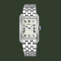 A Seiko women's analog watch with a silver-toned stainless steel link bracelet, a rectangular silver case, a white sunburst dial with black Roman numerals, and blue hands.
