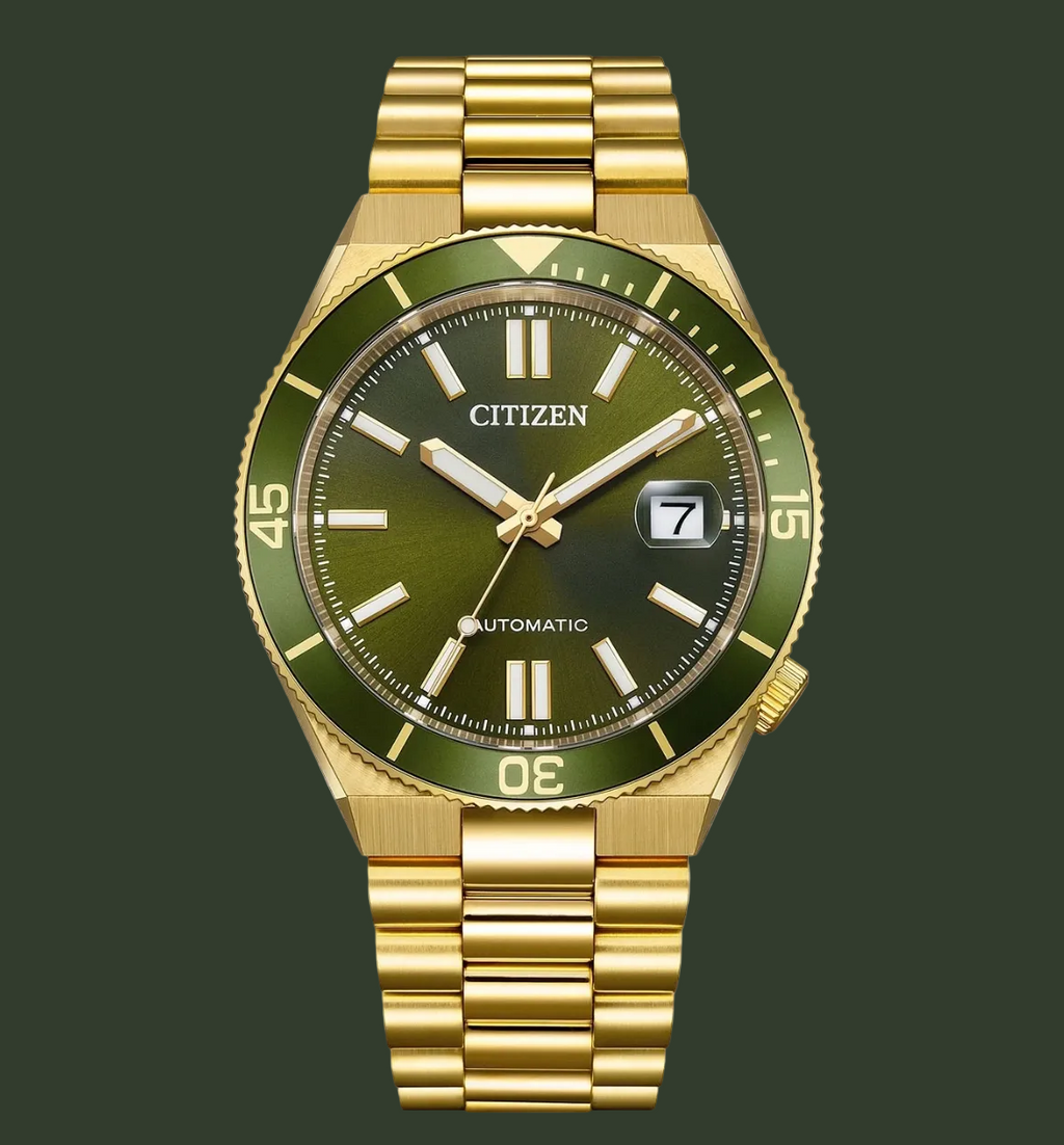 Gold watch with green face on a white background