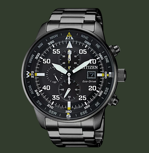 Citizen Eco-Drive wrist watch with a black stainless steel case and integrated link bracelet, featuring a black dial with white and yellow markings, three subdials, and a date window.