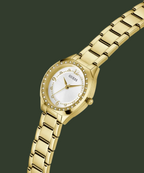 Gold watch with a white face on a white background