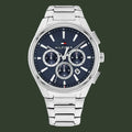 Tommy Hilfiger watch with blue dial and silver metal strap on a white background