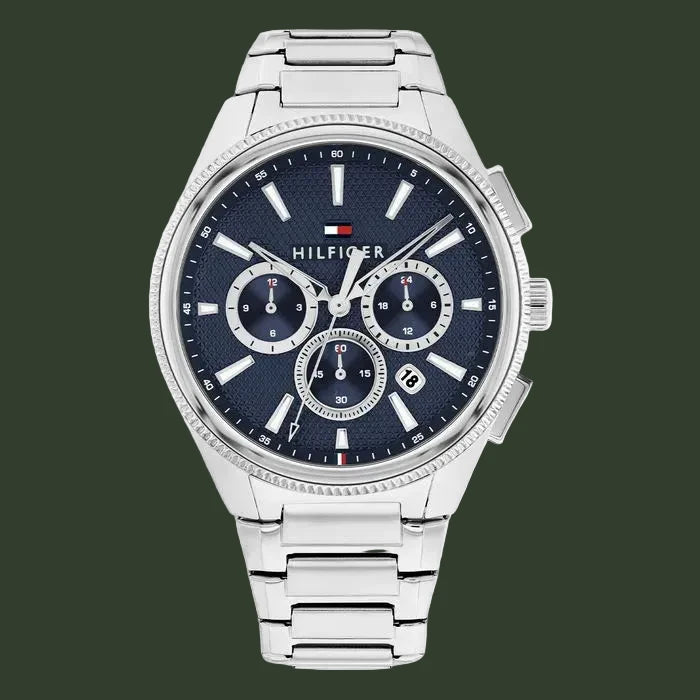 Tommy Hilfiger watch with blue dial and silver metal strap on a white background