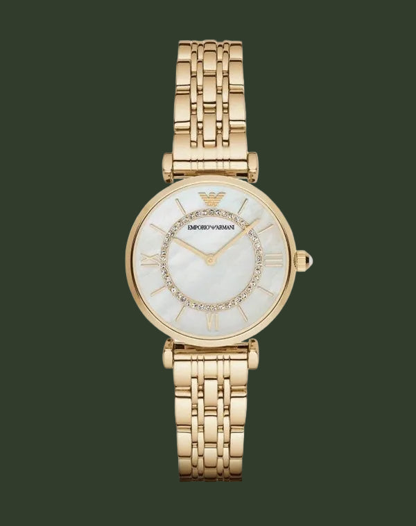Gold watch with a white face on a white background