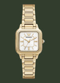 Gold watch with a white face on a white background