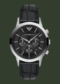An Emporio Armani analog watch with a black dial, silver-tone case, and a black leather strap, shown against a plain white background.