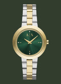 Two-tone watch with green face and gold accents on a white background