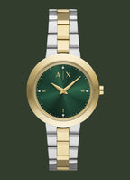 Two-tone watch with green face and gold accents on a white background