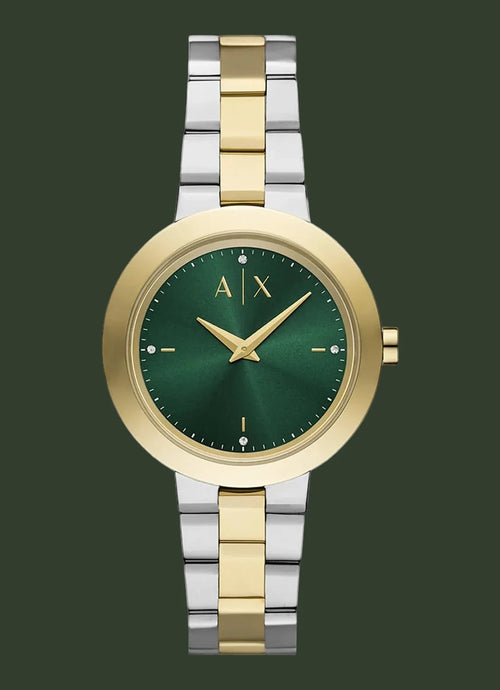 Two-tone watch with green face and gold accents on a white background