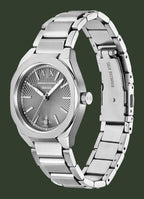A stainless steel wrist watch with a silver textured dial, silver-tone case, and matching steel link bracelet, shown on a plain white background.