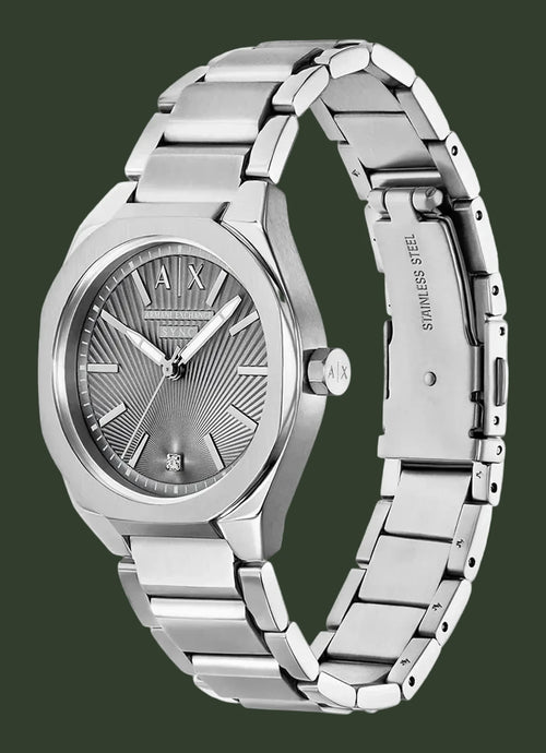 A stainless steel wrist watch with a silver textured dial, silver-tone case, and matching steel link bracelet, shown on a plain white background.