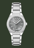 An analog wristwatch with a silver stainless steel case and integrated metal link bracelet, featuring a textured sunburst dial with silver-tone hands and markers.