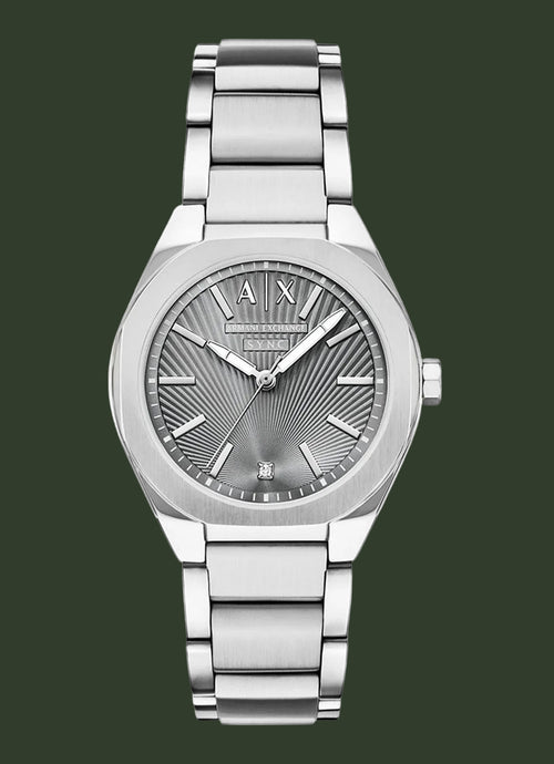 An analog wristwatch with a silver stainless steel case and integrated metal link bracelet, featuring a textured sunburst dial with silver-tone hands and markers.