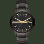 Black Armani Exchange watch with gold accents on a white background