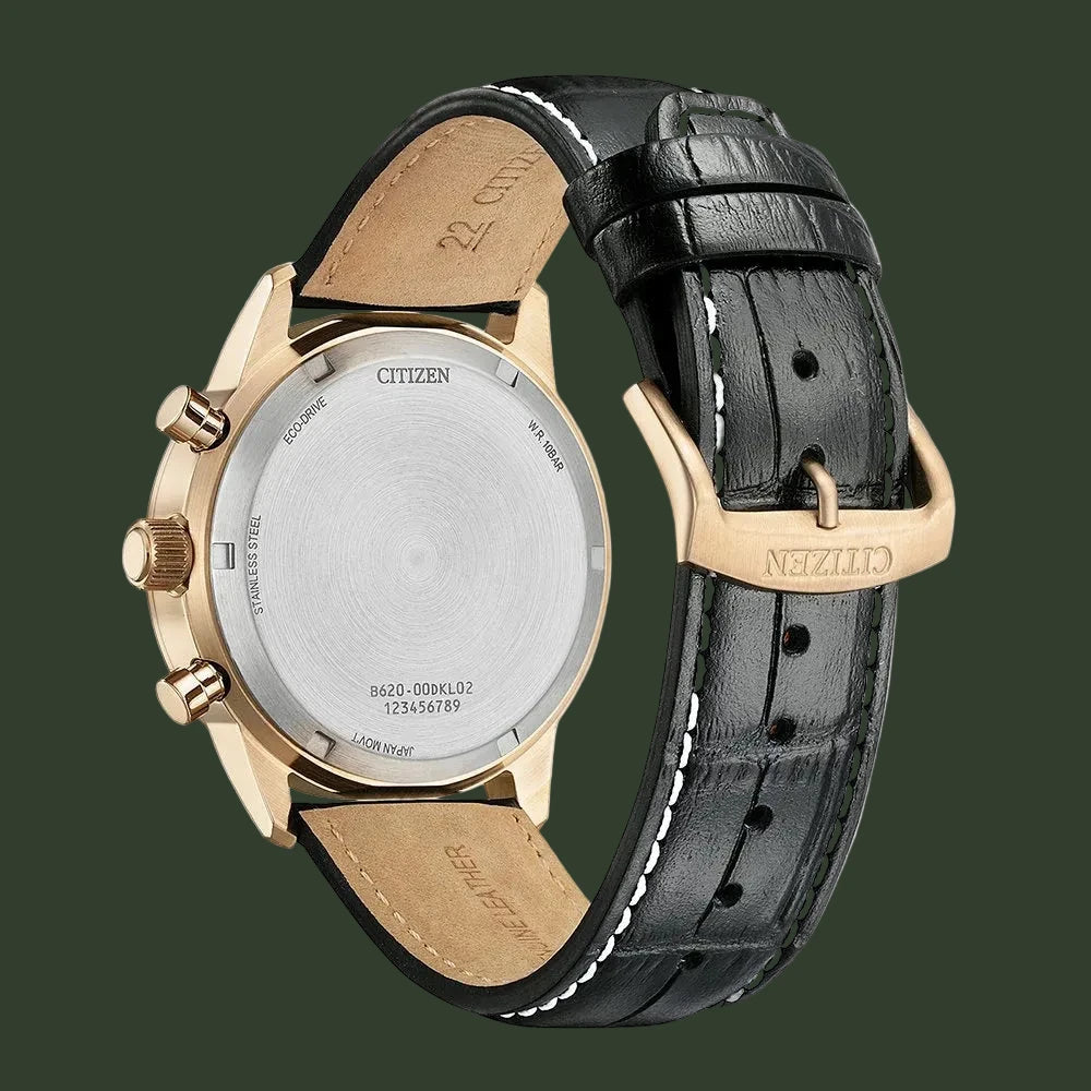 Citizen watch with black leather strap and gold case on a white background