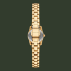 A gold-tone stainless steel watch with a matching link bracelet, shown from the back on a solid white background. The brand name 'MICHAEL KORS' is clearly engraved on the clasp.