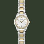 An Armani Exchange women's two-tone watch with a silver and gold-tone metal link bracelet, a white dial with mother-of-pearl texture, and a bezel set with small clear crystals.