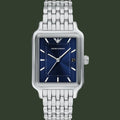 Silver watch with blue face on a white background