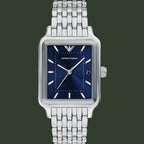 Silver watch with blue face on a white background