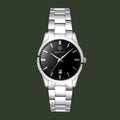A GANT analog wristwatch with a silver stainless steel link bracelet, a round silver case, and a black dial featuring silver hour markers, hands, and a date window.