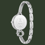 Silver stainless steel women's watch shown from the back, featuring a round case, metal link bracelet, and the GUESS logo on the back glass.
