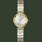 Two-tone gold and silver watch with a white face on a white background