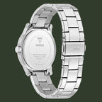 Silver Guess watch with a metal band on a white background