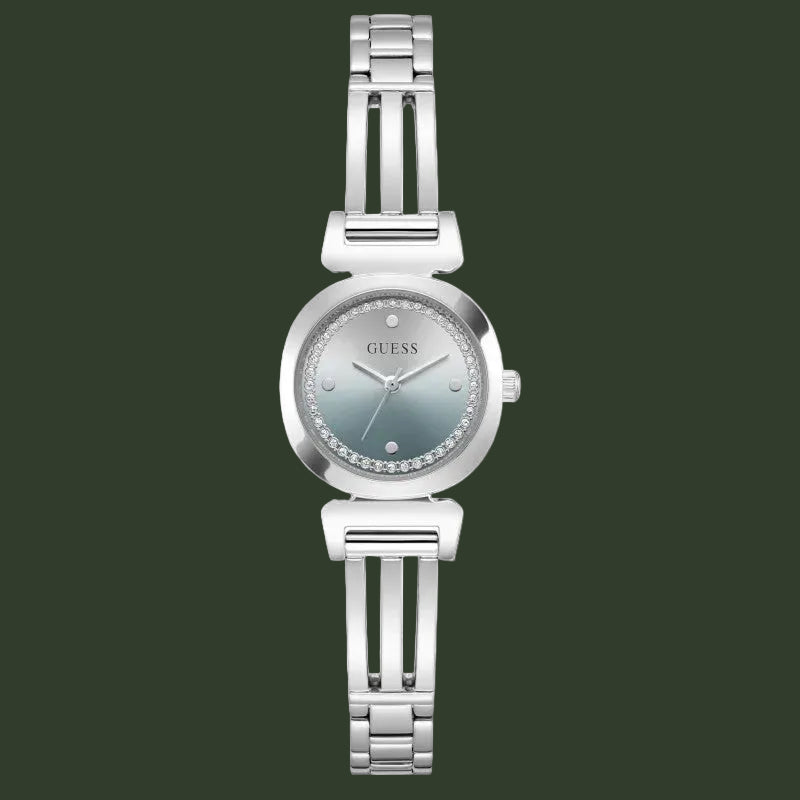 A women's GUESS wristwatch with a silver-toned metal link bracelet, a round bezel, and a silver dial accented with a ring of small clear crystals around the hour markers.