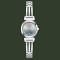 A women's GUESS wristwatch with a silver-toned metal link bracelet, a round bezel, and a silver dial accented with a ring of small clear crystals around the hour markers.