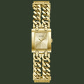 Gold-tone Guess women's watch with a rectangular case, sunburst dial, and a double curb link bracelet, shown on a plain white background.