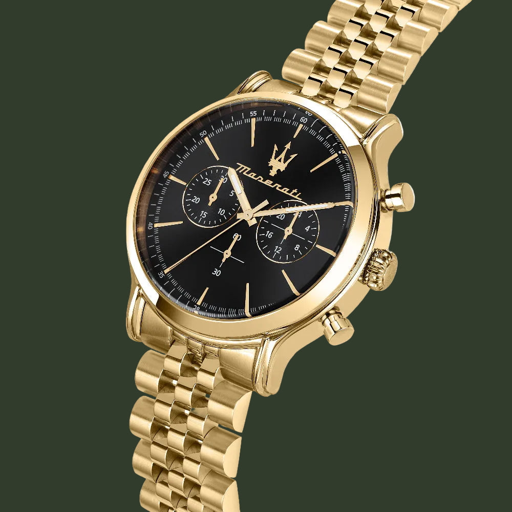 Gold watch with black face on a white background