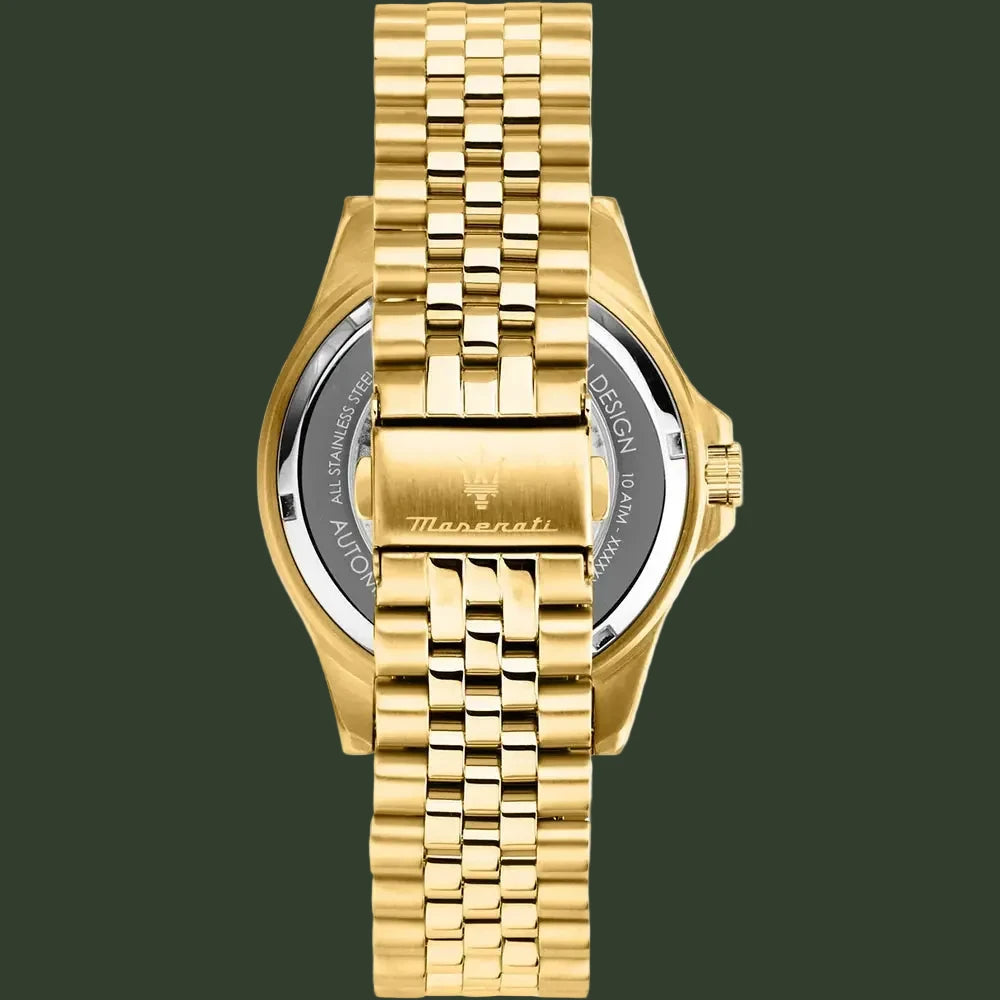 Gold-tone stainless steel watch with a matching link bracelet, shown from the back on a white background. The case back features a clear crystal and a gold-tone clasp with the 'Maserati' brand name engraved.