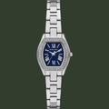 Michael Kors women's analog watch with a silver-tone metal link bracelet, a bezel set with small clear stones, and a deep blue dial with white Roman numerals.